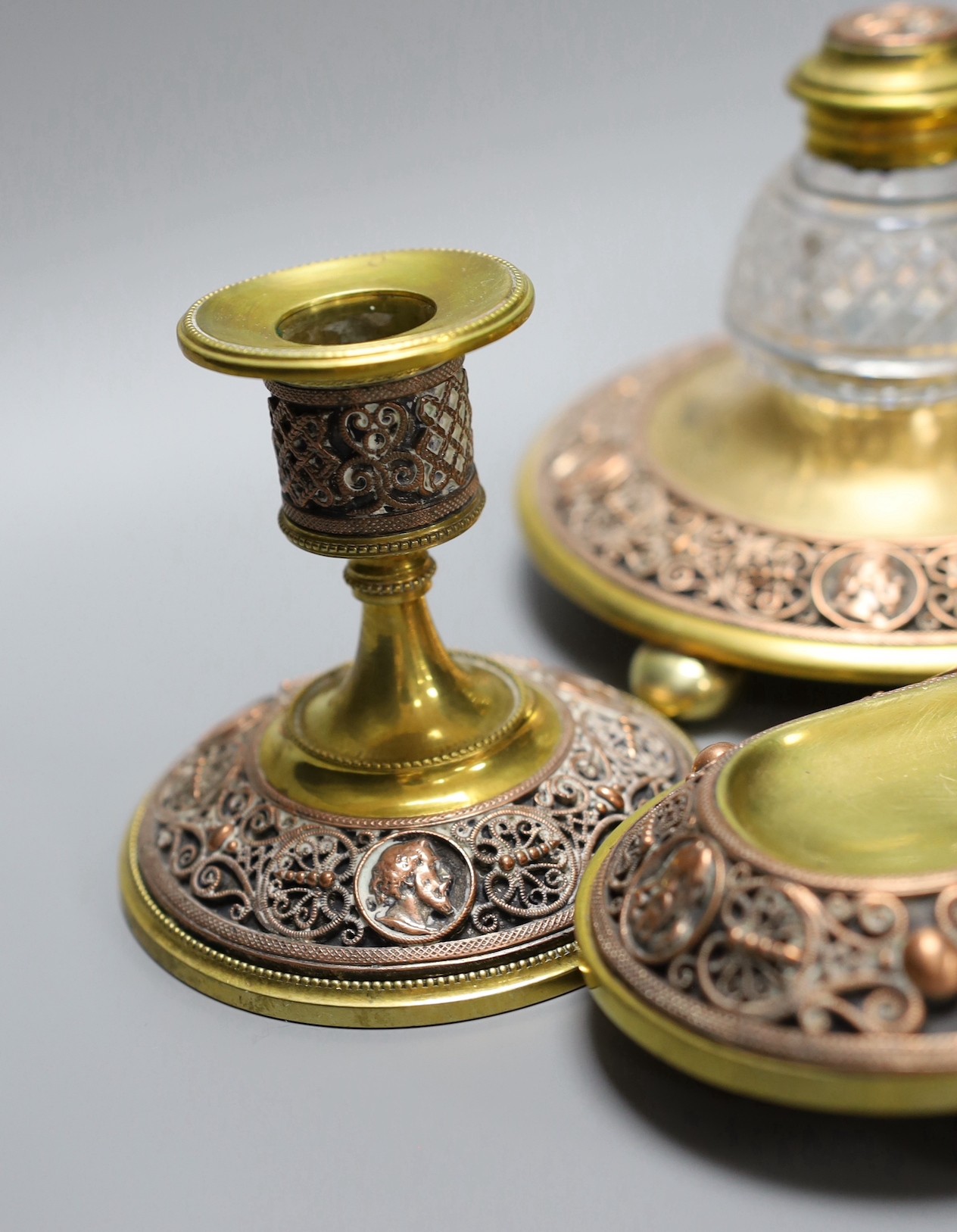 A 19th century brass and copper filigree desk set, 23cm